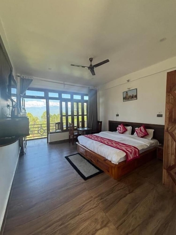 Imagen de la habitación del Hotel Lap of Himalayas Resort Kausani. Foto 16