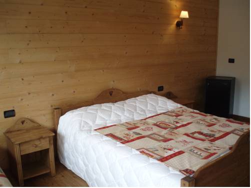 Imagen de la habitación del Hotel L'artisin. Foto 2