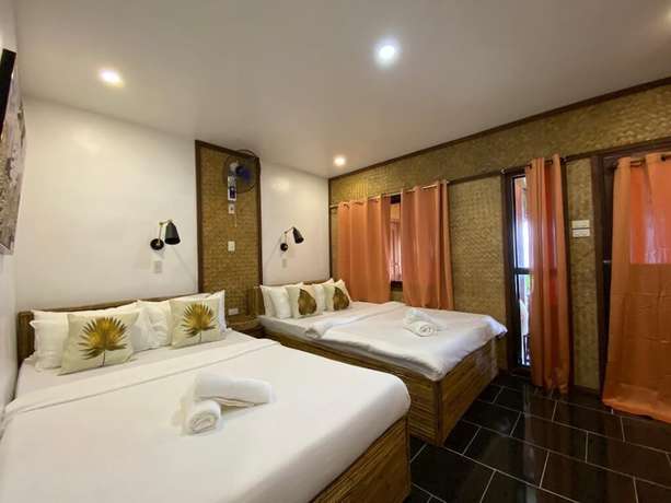 Imagen de la habitación del Hotel Las Cabanas Beach Resort. Foto 3