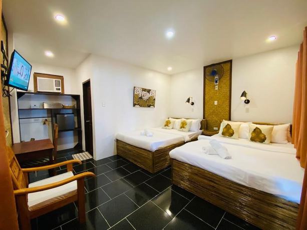 Imagen de la habitación del Hotel Las Cabanas Beach Resort. Foto 7