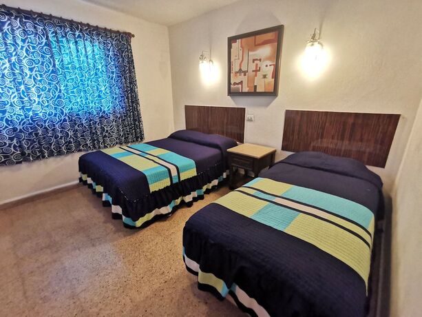 Imagen de la habitación del Hotel Las Dalias Inn. Foto 16