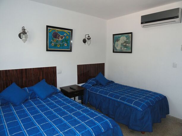 Imagen de la habitación del Hotel Las Dalias Inn. Foto 20