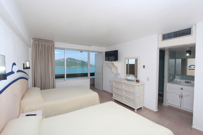 Imagen de la habitación del Hotel Las Flores Beach Resort. Foto 8