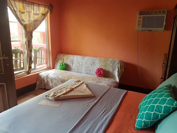 Imagen de la habitación del Hotel Las Palmeras Beachfront. Foto 11