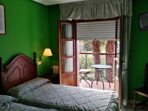Imagen de la habitación del Hotel Las Palmeras, Celorio. Foto 8