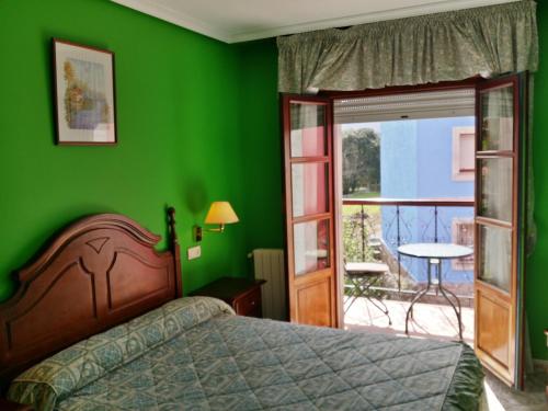 Imagen de la habitación del Hotel Las Palmeras, Celorio. Foto 10