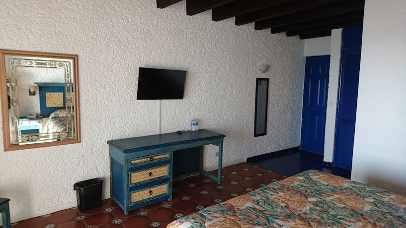 Imagen de la habitación del Hotel Las Rocas Resort and Spa. Foto 7
