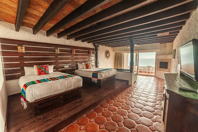 Imagen de la habitación del Hotel Las Rocas Resort and Spa. Foto 8