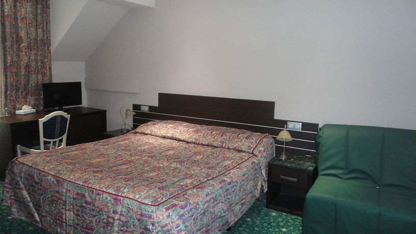 Imagen de la habitación del Hotel L'auberge Du Souverain. Foto 2