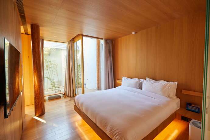 Imagen de la habitación del Hotel Layering Courtyard Hutel Qianmen. Foto 10