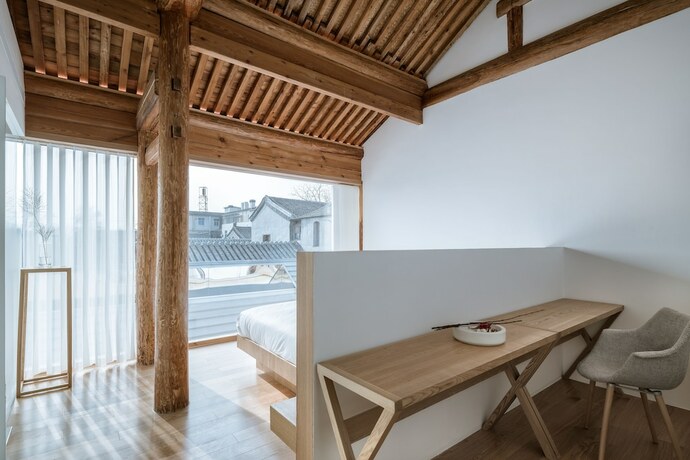 Imagen de la habitación del Hotel Layering Courtyard Hutel Qianmen. Foto 20