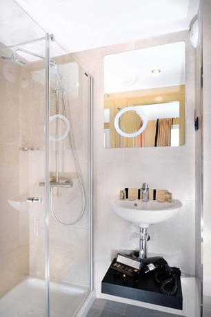 Imagen de la habitación del Hotel Le 18 Paris. Foto 18