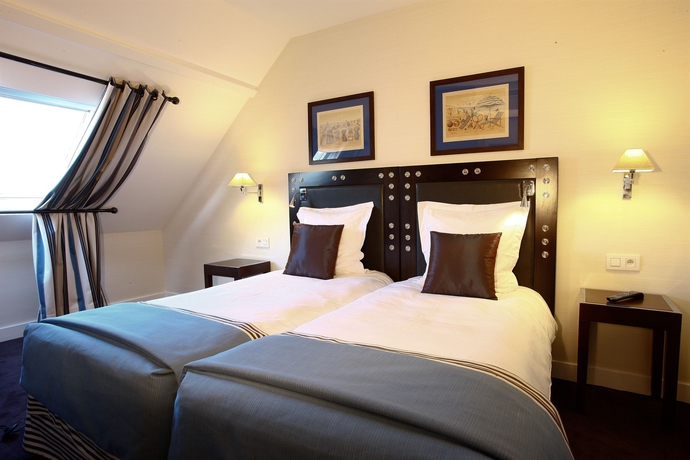 Imagen de la habitación del Hotel Le 46. Foto 9