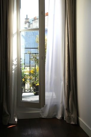 Imagen de la habitación del Hotel Le 9hotel Opera. Foto 9