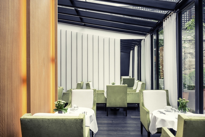 Imagen del bar/restaurante del Hotel Le Belgrand Hotel Paris Champs Elysees, Tapestry Collection by Hilton. Foto 2