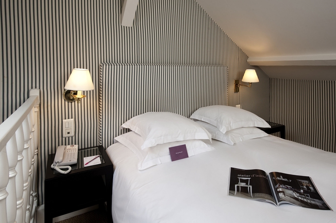 Imagen de la habitación del Hotel Le Belgrand Hotel Paris Champs Elysees, Tapestry Collection by Hilton. Foto 12