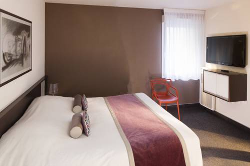 Imagen de la habitación del Hotel Le Bugatti. Foto 11