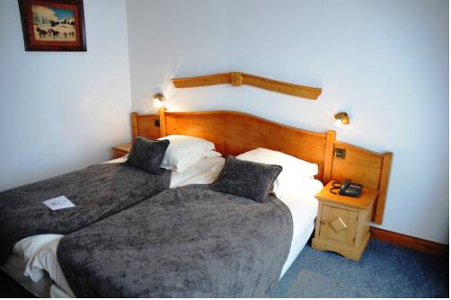 Imagen de la habitación del Hotel Le Calgary. Foto 9