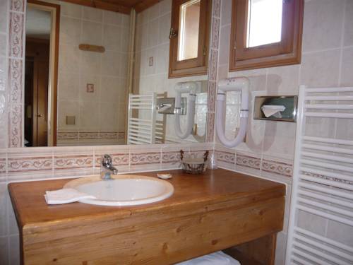 Imagen de la habitación del Hotel Le Caprice Des Neiges. Foto 14