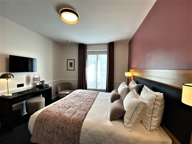 Imagen de la habitación del Hotel Le Cercle Tour Eiffel. Foto 3