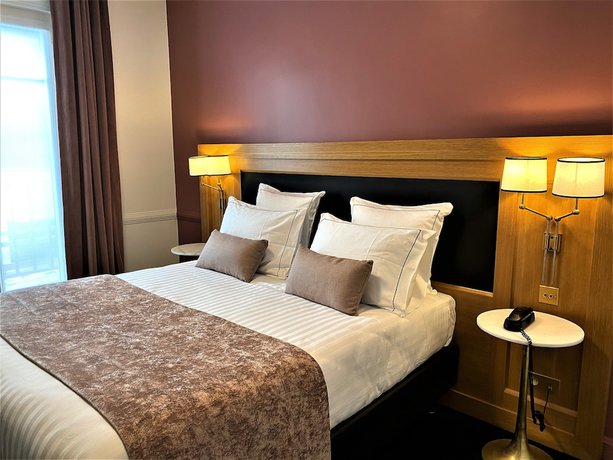 Imagen de la habitación del Hotel Le Cercle Tour Eiffel. Foto 4