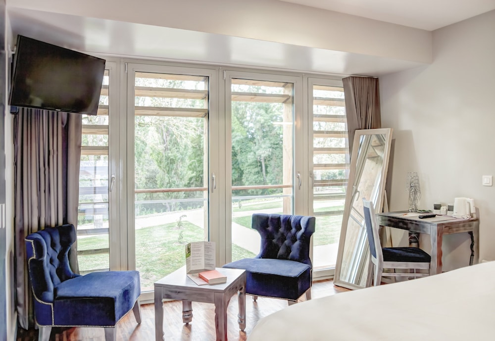 Imagen de la habitación del Hotel Le Château Du Bost. Foto 11