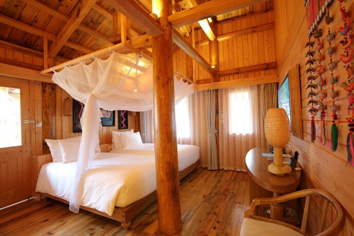 Imagen de la habitación del Hotel Le Champ Tu Le Resort. Foto 16