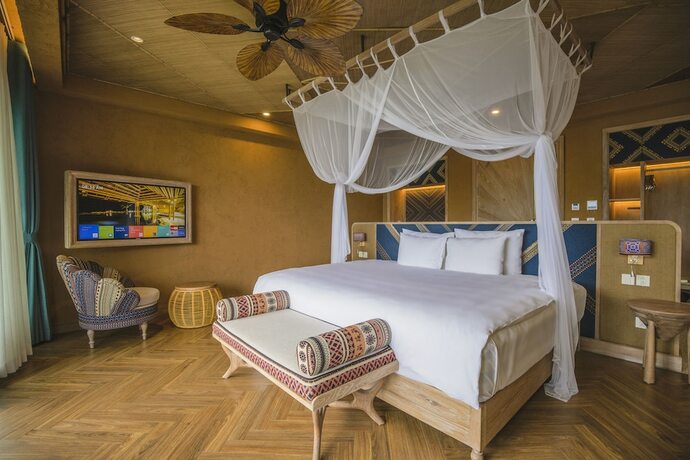 Imagen de la habitación del Hotel Le Champ Tu Le Resort. Foto 18