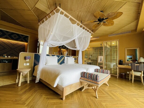 Imagen de la habitación del Hotel Le Champ Tu Le Resort. Foto 19