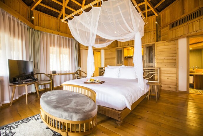 Imagen de la habitación del Hotel Le Champ Tu Le Resort. Foto 20