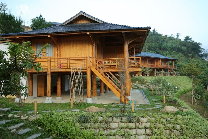 Imagen de la habitación del Hotel Le Champ Tu Le Resort. Foto 29