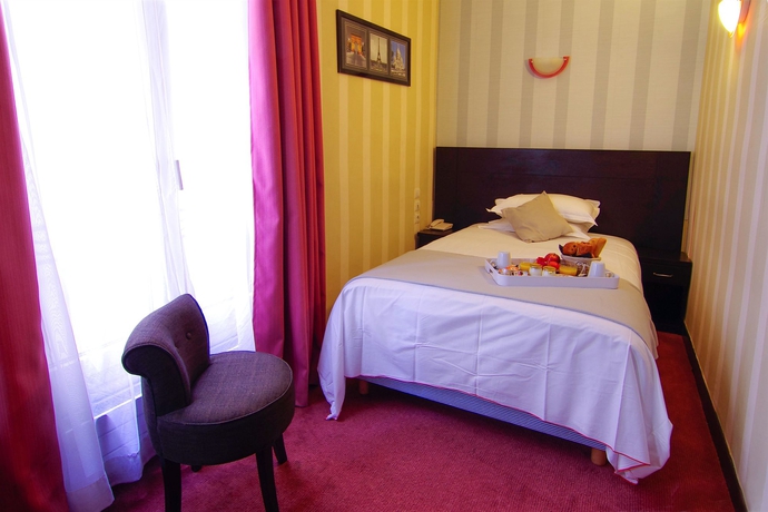 Imagen de la habitación del Hotel Le Clery Paris. Foto 8