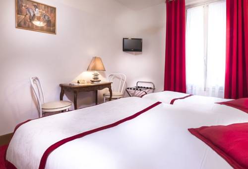 Imagen de la habitación del Hotel Le Clos D'alésia. Foto 3