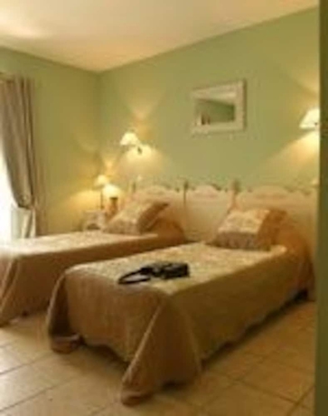 Imagen de la habitación del Hotel Le Clos De Pradines. Foto 2