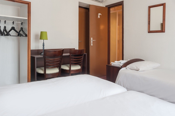 Imagen de la habitación del Hotel Le Collonges. Foto 15