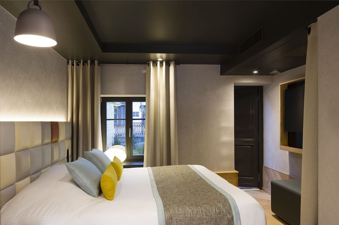 Imagen de la habitación del Hotel Le Colombier Suites. Foto 15