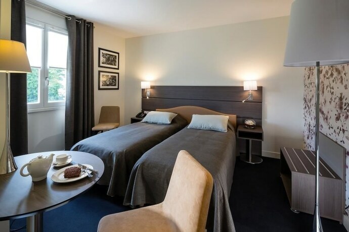 Imagen de la habitación del Hotel Le Cottage de Clairefontaine. Foto 20