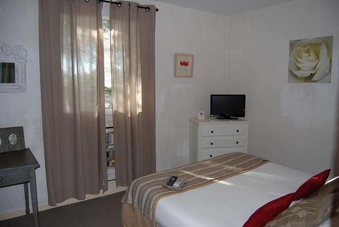 Imagen de la habitación del Hotel Le Devem de Mirapier. Foto 7