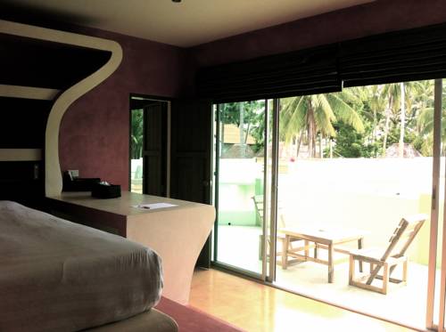 Imagen de la habitación del Hotel Le Divine Comedie Beach Resort. Foto 3