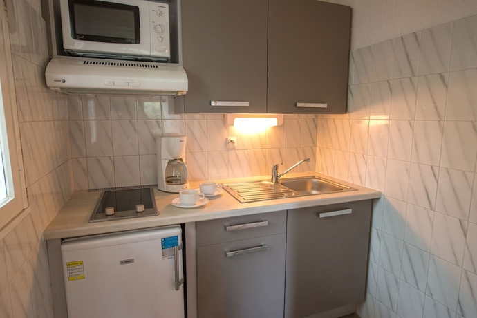 Imagen de la habitación del Hotel Le Domaine Du Mas Blanc By Popinns. Foto 15