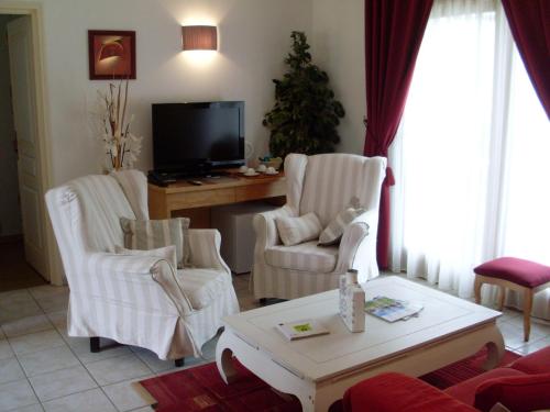 Imagen de la habitación del Hotel Le Fiacre. Foto 6