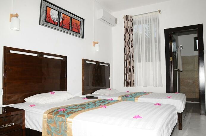 Imagen de la habitación del Hotel Le Flamboyant. Foto 2