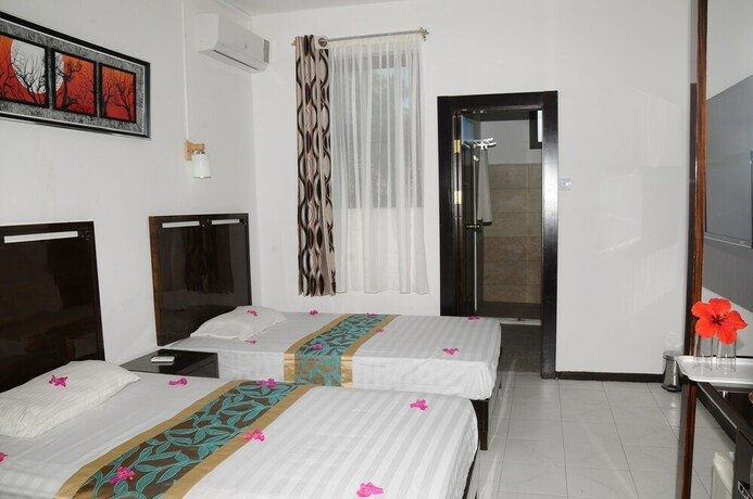 Imagen de la habitación del Hotel Le Flamboyant. Foto 3