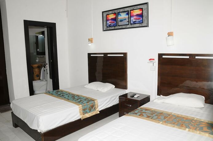 Imagen de la habitación del Hotel Le Flamboyant. Foto 6