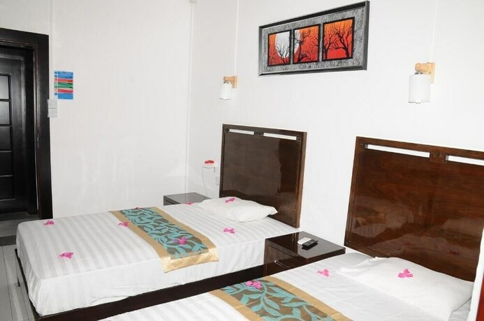 Imagen de la habitación del Hotel Le Flamboyant. Foto 15