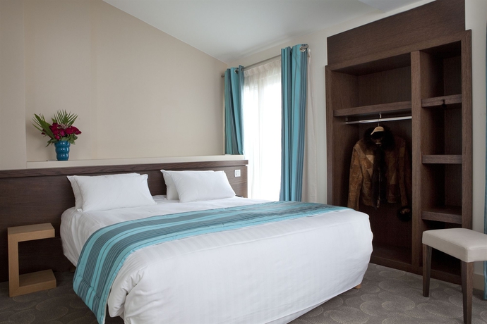 Imagen de la habitación del Hotel Le Grand H&ocirc;tel de Normandie. Foto 11