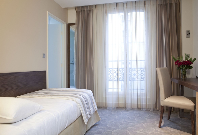 Imagen de la habitación del Hotel Le Grand H&ocirc;tel de Normandie. Foto 12