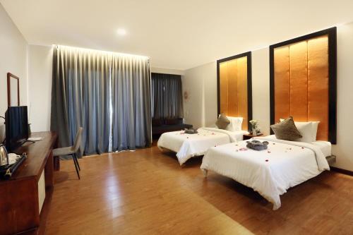 Imagen de la habitación del Hotel Le Grande Indochine. Foto 18