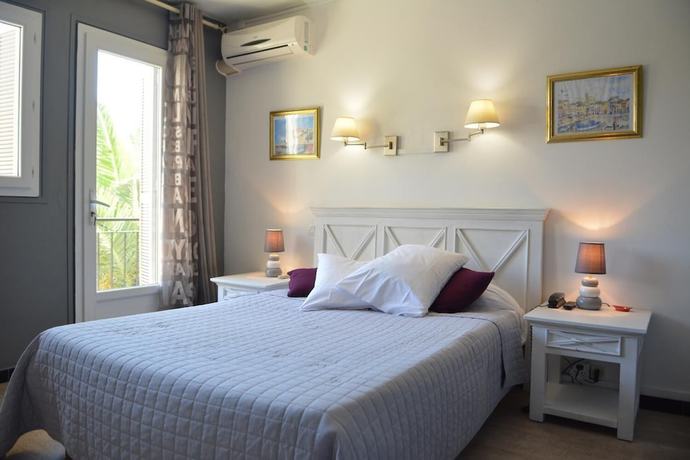 Imagen de la habitación del Hotel Le Grillon, L'&Icirc;le-Rousse. Foto 8