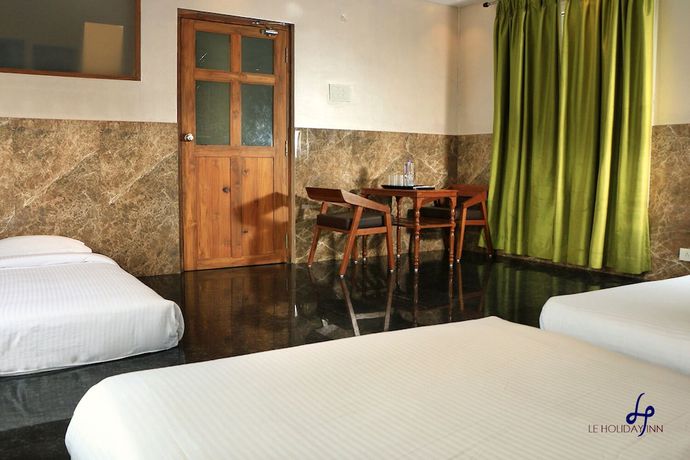 Imagen de la habitación del Hotel Le Holiday Inn. Foto 6